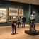 People observing art in a museum